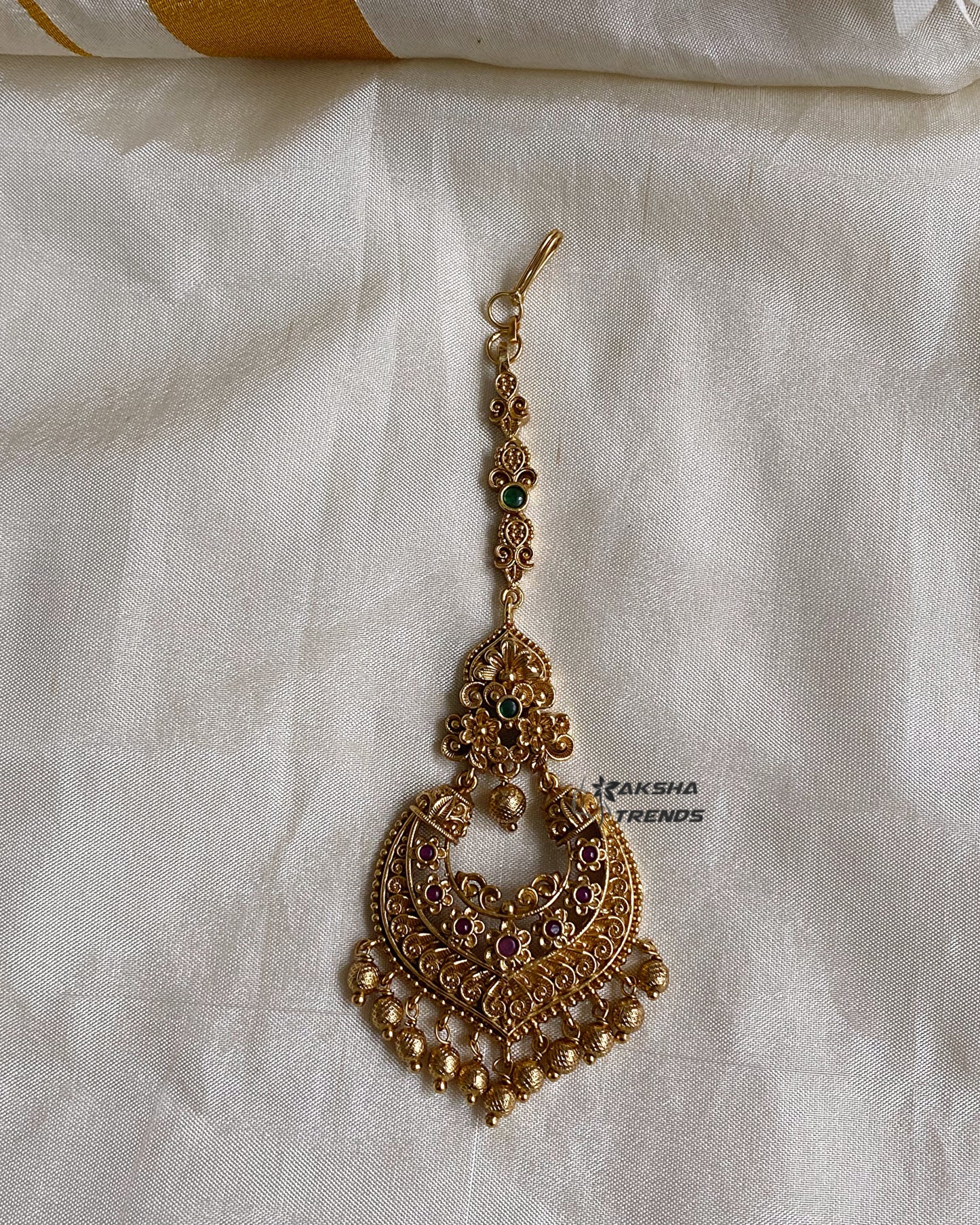 Premium gold tikka Aksha Trends