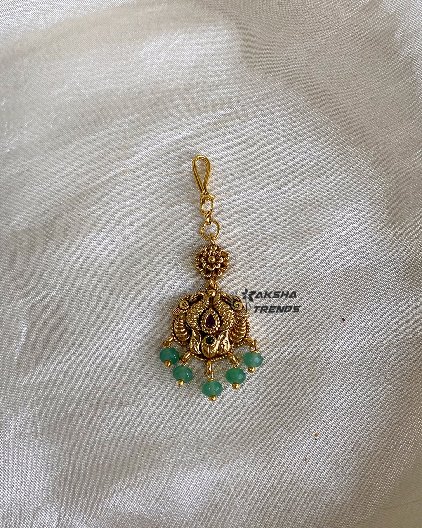 Premium gold tikka Aksha Trends