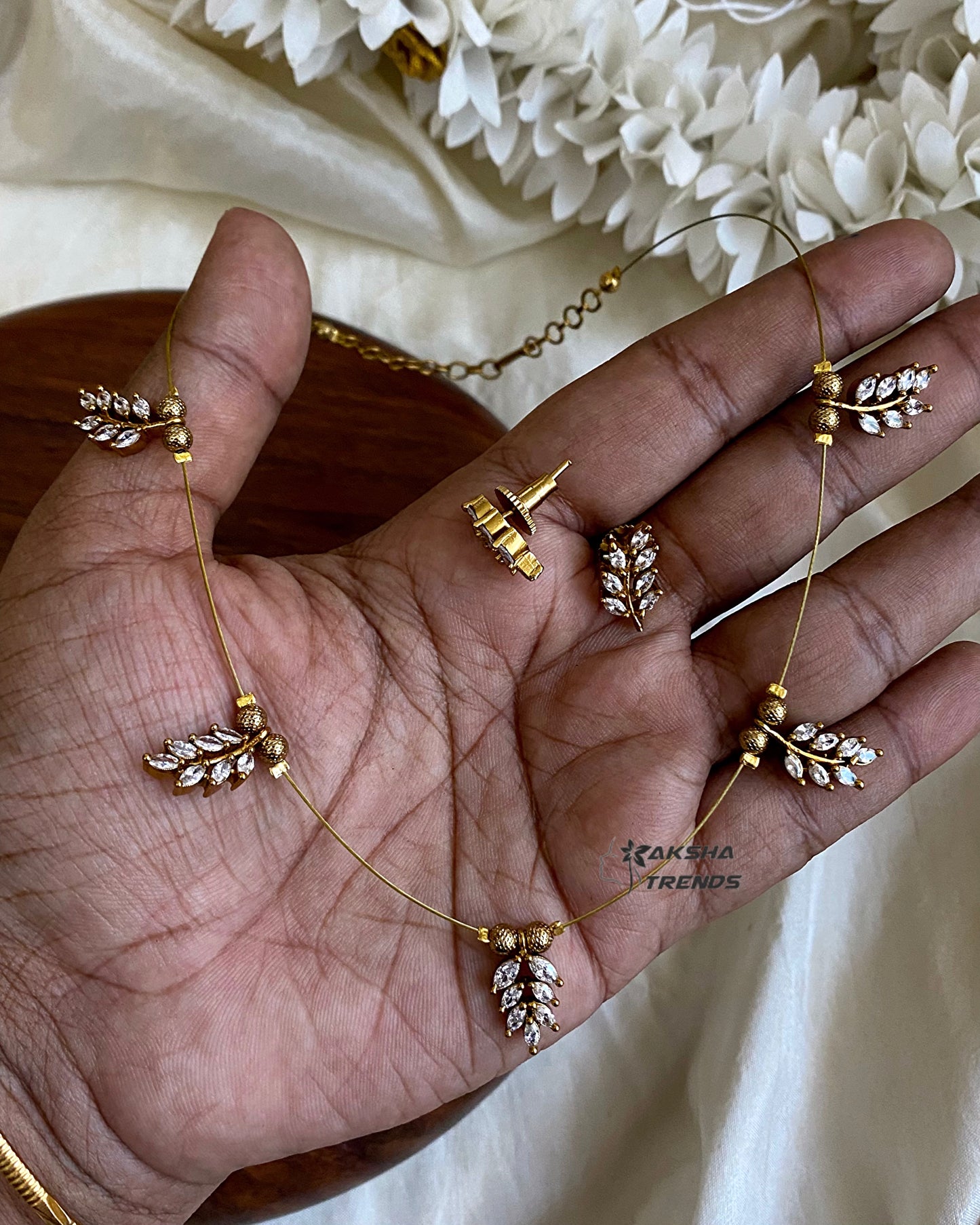 Invisible Necklace -leafy white Aksha Trends