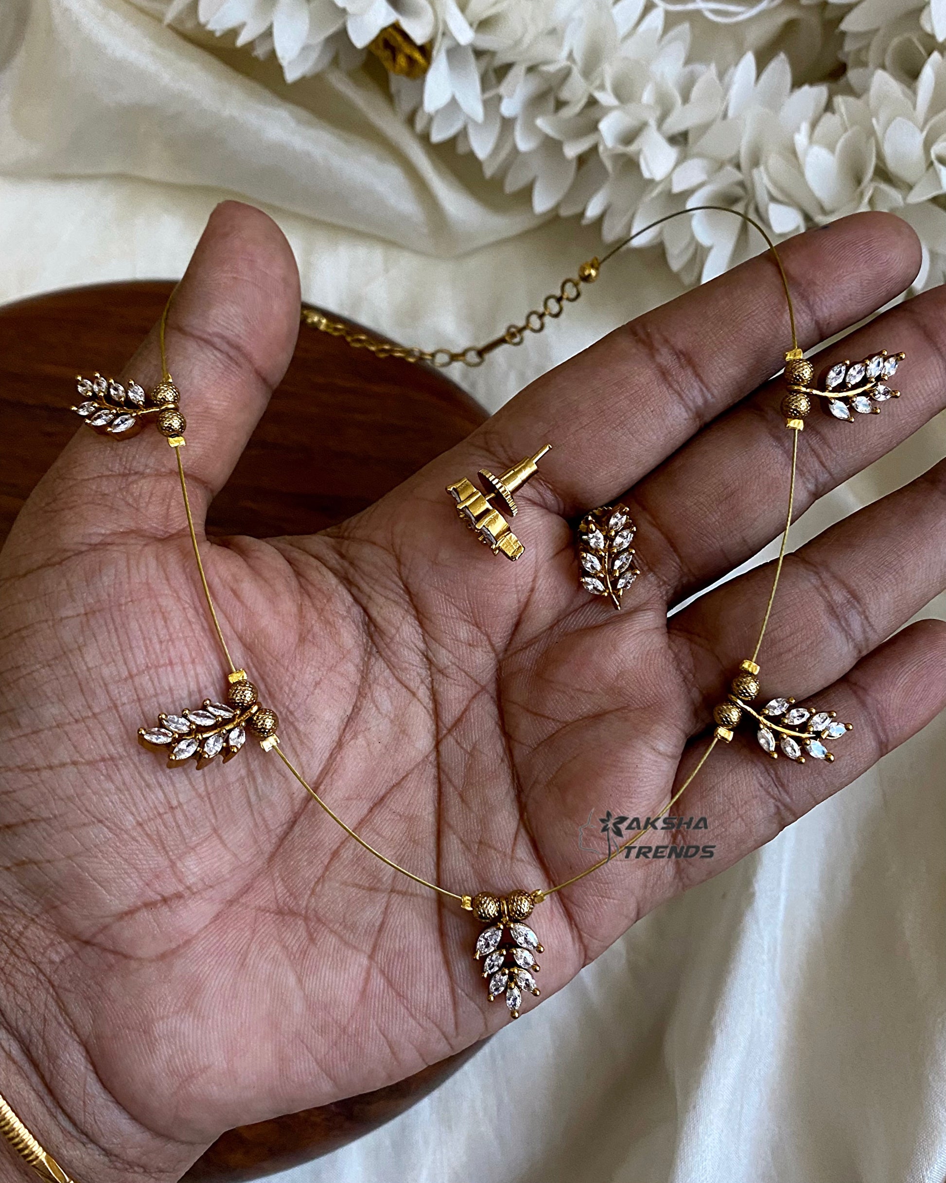 Invisible Necklace -leafy white Aksha Trends