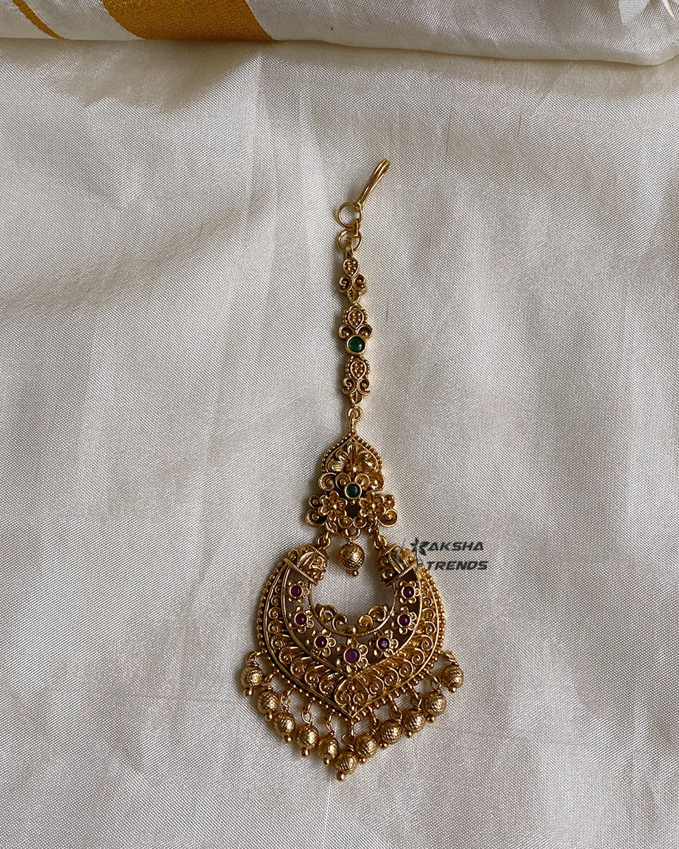 Premium gold tikka Aksha Trends 